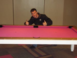 Cagle's Billiards employee working on billiard table repair