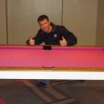 Cagle's Billiards employee working on billiard table repair