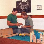 Cagle's Billiards employees repairing billiard table